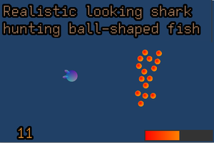 play Realistic Looking Shark Hunting Ball-Shaped Fish